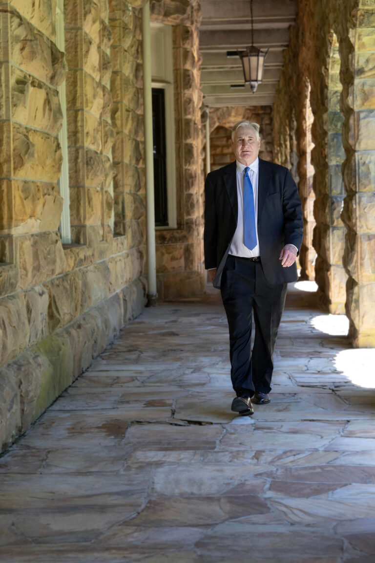 Kenny Daugherty walks in a school corridor