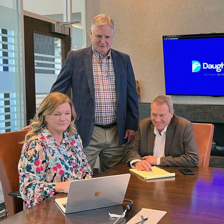 Kenny Daugherty (center) meets with Lisa Martin & Jeff Martin